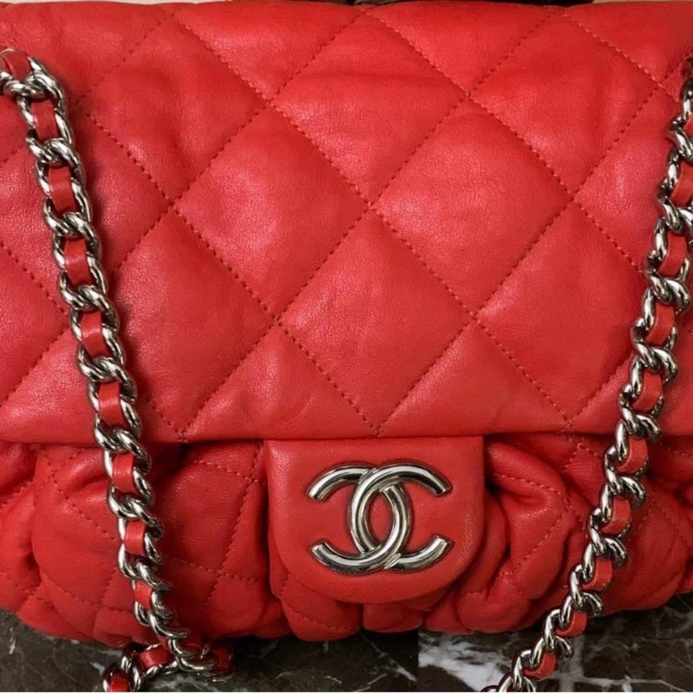 Chanel Chain Around bag is made from soft quilted leather in bright red.